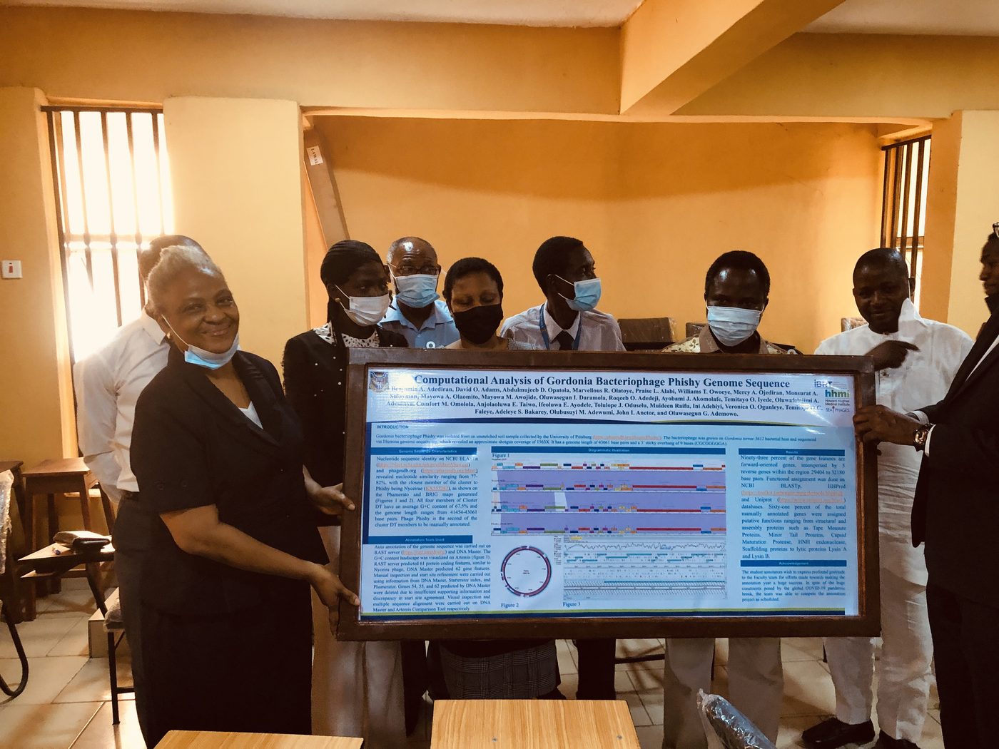 Unveiling an IBRT research poster with faculty