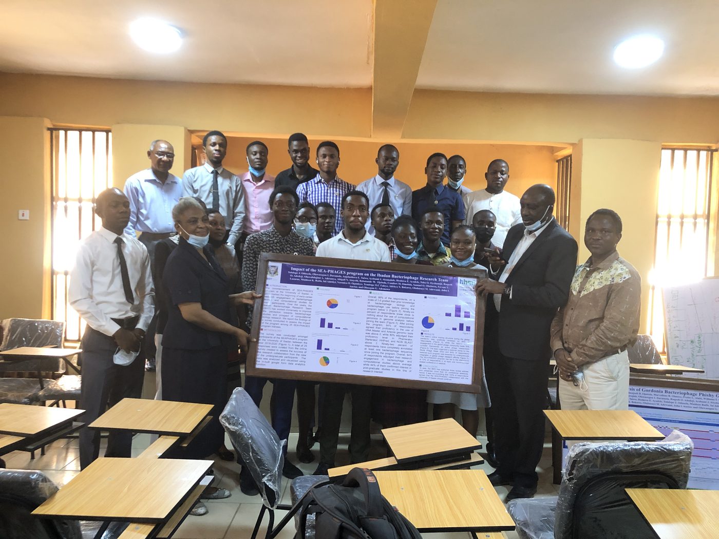 Faculty and students at the poster presentation